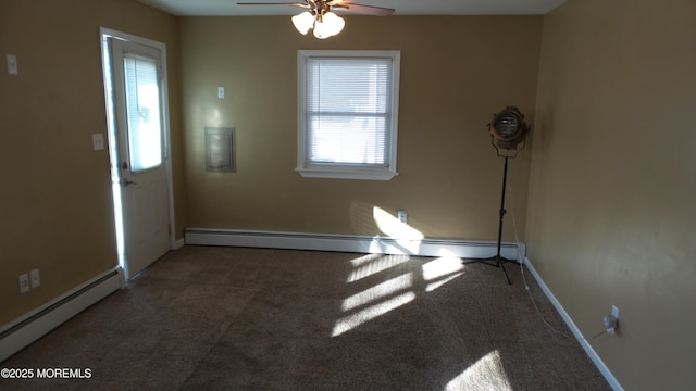 unfurnished room with a baseboard radiator, baseboards, carpet, and ceiling fan