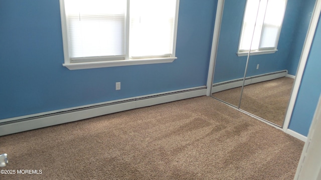 unfurnished bedroom with a closet, multiple windows, and carpet