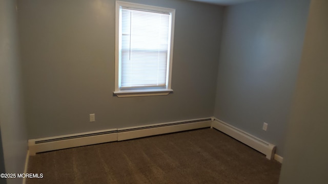 spare room with carpet floors and baseboard heating