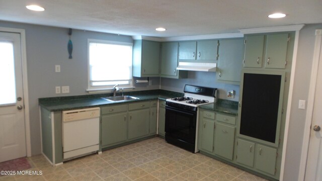 kitchen featuring under cabinet range hood, green cabinetry, range with gas stovetop, white dishwasher, and a sink