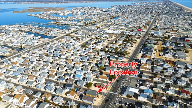 aerial view featuring a residential view and a water view