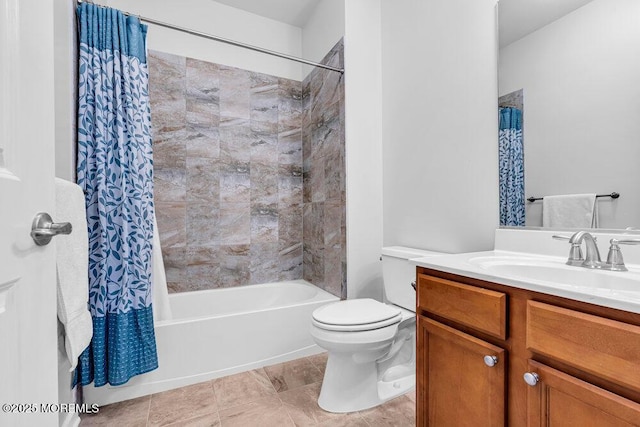 full bath with tile patterned floors, shower / bath combo with shower curtain, toilet, and vanity