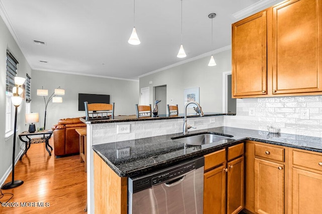 kitchen with visible vents, open floor plan, a peninsula, stainless steel dishwasher, and a sink