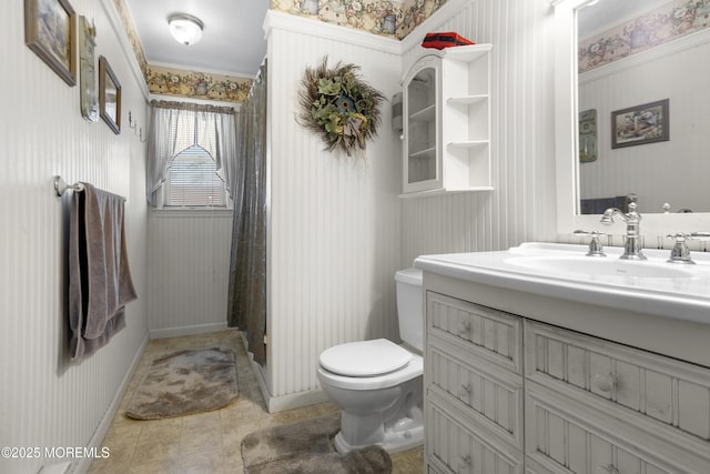 bathroom featuring wallpapered walls, toilet, and vanity