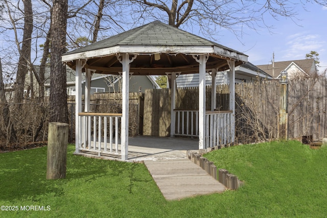 exterior space with a gazebo, a yard, and fence