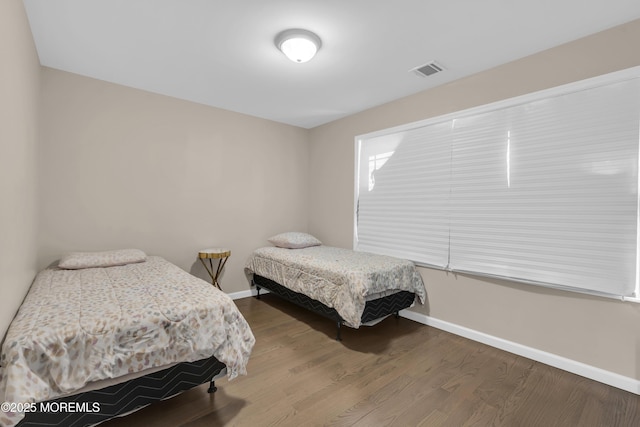 71 Broadway Ave, Lakewood, NJ 08701 - bedroom featuring baseboards, visible vents, and wood finished floors