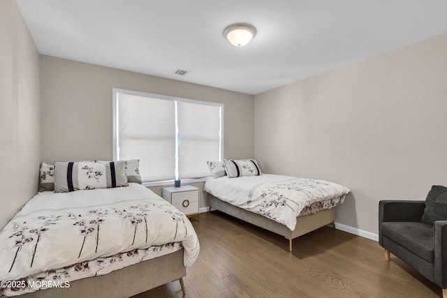 71 Broadway Ave, Lakewood, NJ 08701 - bedroom featuring baseboards, visible vents, and wood finished floors