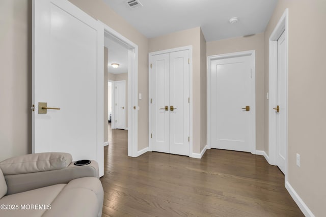 71 Broadway Ave, Lakewood, NJ 08701 - living area with visible vents, dark wood-style flooring, and baseboards