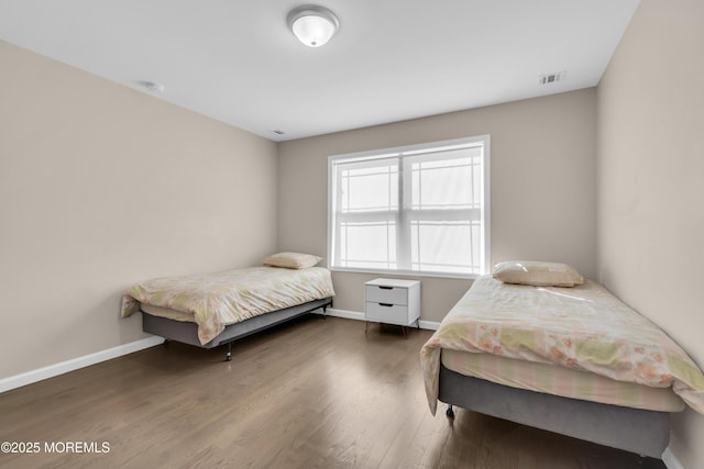 71 Broadway Ave, Lakewood, NJ 08701 - bedroom with visible vents, wood finished floors, and baseboards