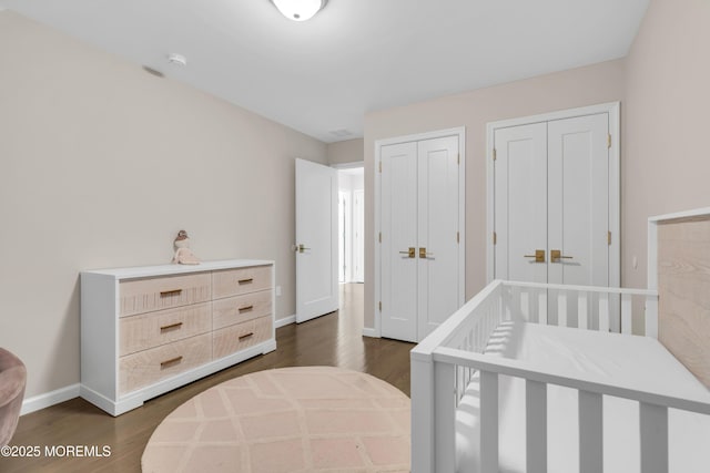 71 Broadway Ave, Lakewood, NJ 08701 - bedroom with dark wood-style flooring, baseboards, and multiple closets