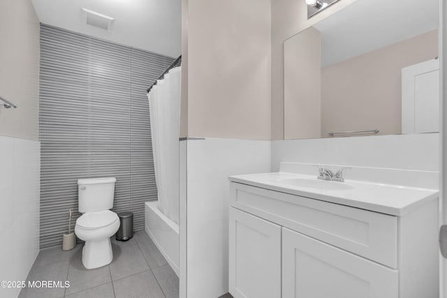 71 Broadway Ave, Lakewood, NJ 08701 - full bathroom featuring tile walls, toilet, visible vents, tile patterned flooring, and vanity