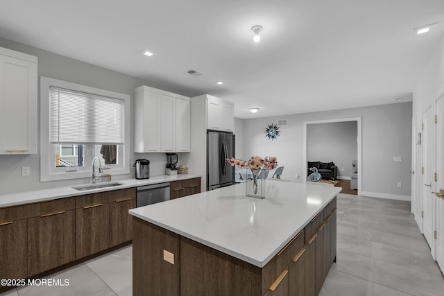 71 Broadway Ave, Lakewood, NJ 08701 - kitchen featuring visible vents, a sink, white cabinetry, light countertops, and appliances with stainless steel finishes