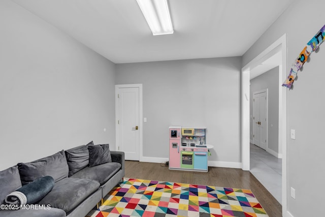 71 Broadway Ave, Lakewood, NJ 08701 - game room featuring baseboards and wood finished floors
