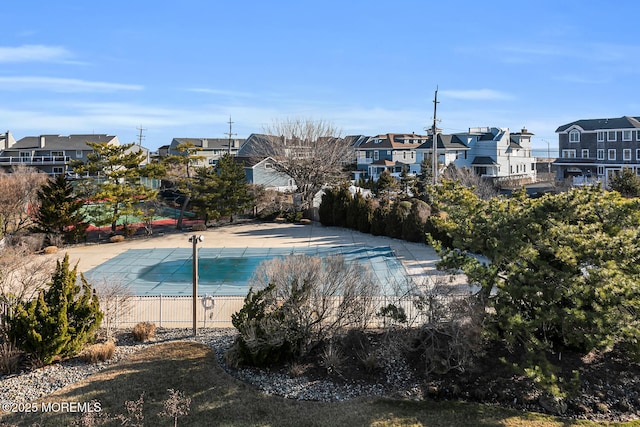 community pool with a residential view