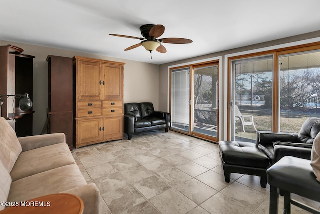 living area featuring a ceiling fan