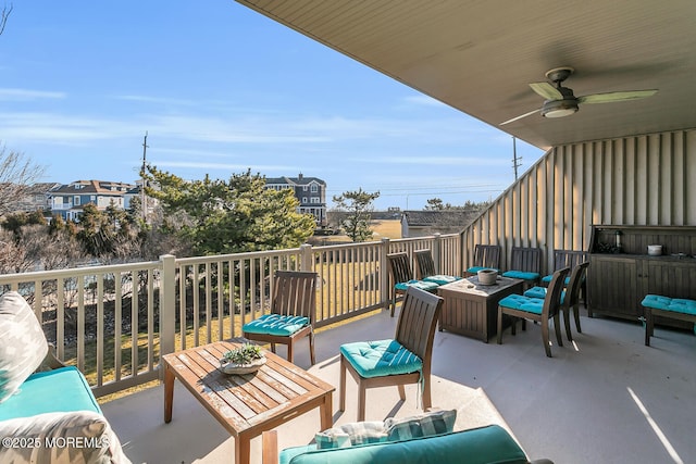 view of patio with an outdoor living space and ceiling fan