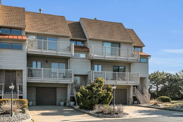 view of property with driveway and an attached garage