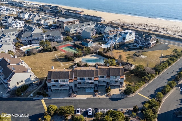 aerial view with a beach view and a water view