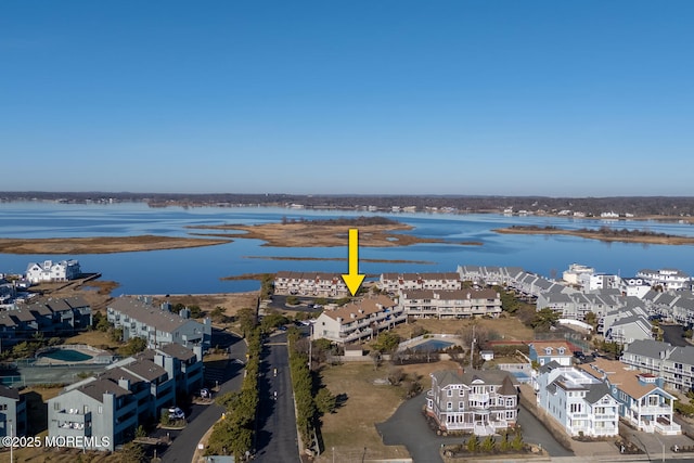 bird's eye view featuring a residential view and a water view