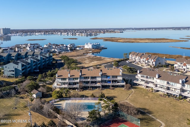 birds eye view of property with a water view