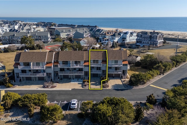 aerial view featuring a water view and a residential view