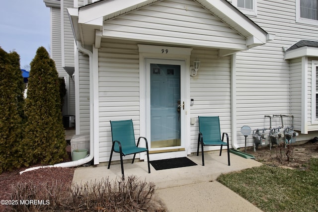 entrance to property featuring a chimney