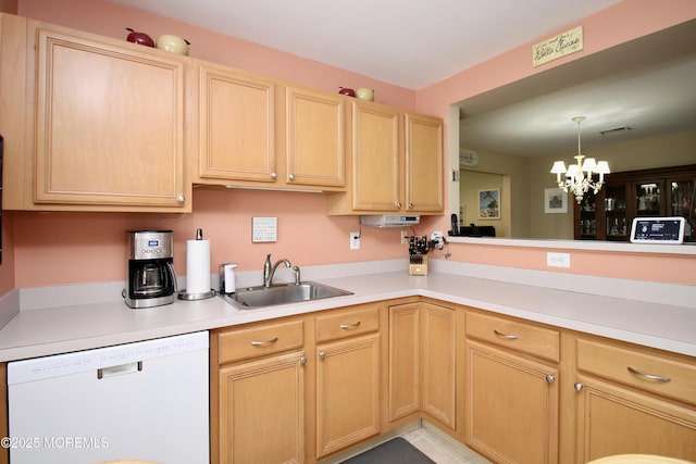 kitchen with light brown cabinets, an inviting chandelier, white dishwasher, a sink, and light countertops