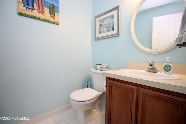 bathroom with tile patterned floors, baseboards, toilet, and vanity