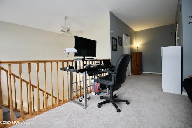 carpeted home office featuring a ceiling fan