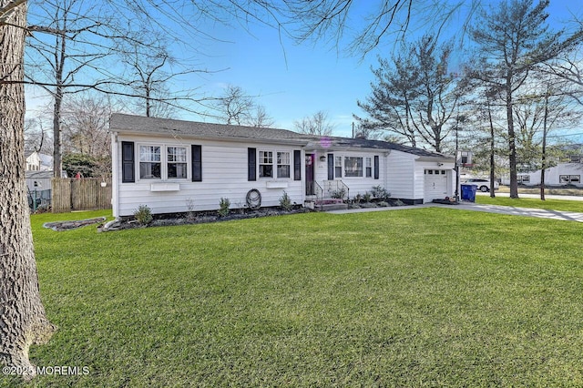 view of front of house with driveway, a front lawn, a garage, and fence