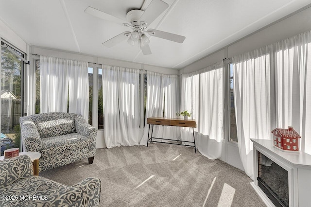 sunroom with plenty of natural light and a ceiling fan