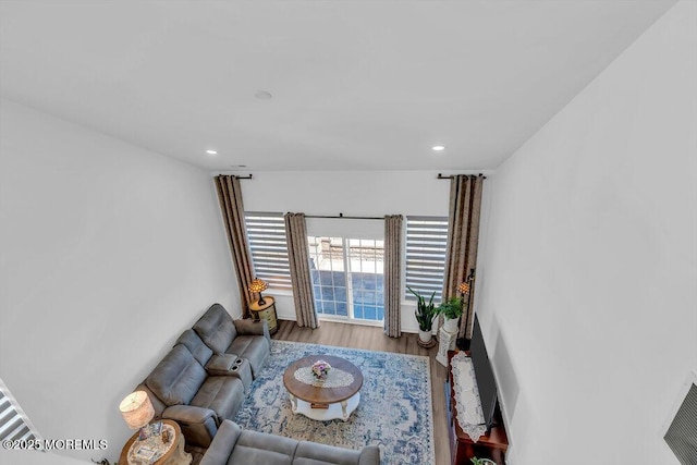living area featuring visible vents, recessed lighting, and wood finished floors