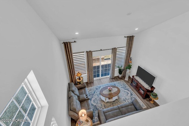 living room with recessed lighting and wood finished floors