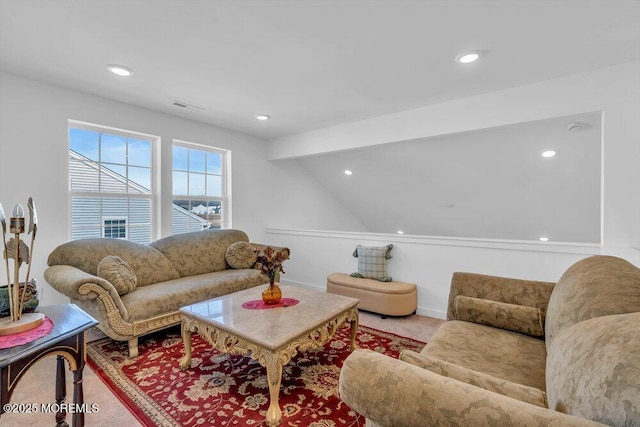 living area featuring recessed lighting and visible vents