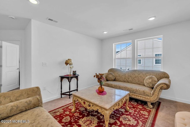 living room featuring visible vents, carpet floors, and baseboards
