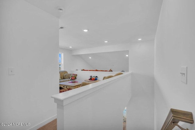 hall with recessed lighting, visible vents, and baseboards