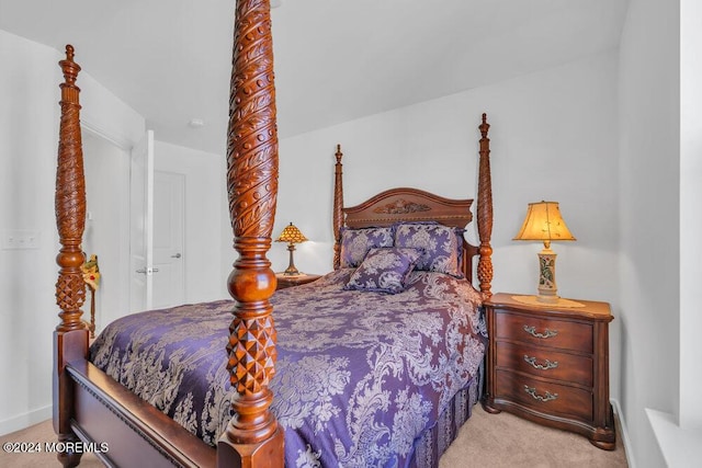 bedroom featuring baseboards and carpet floors