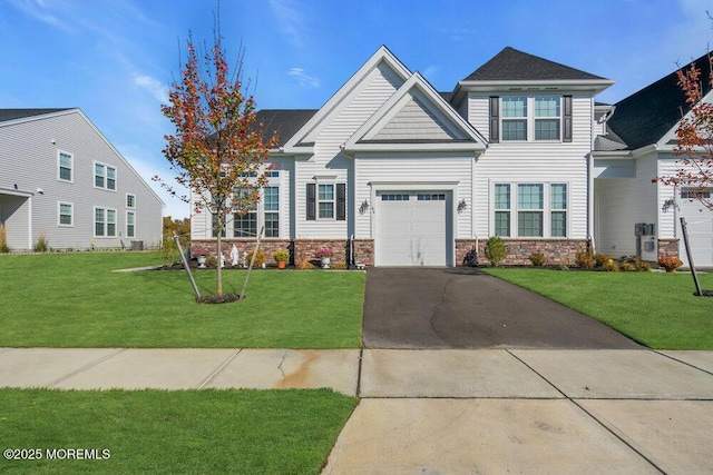 craftsman-style home with driveway and a front yard