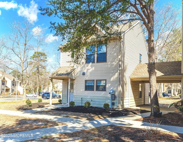 view of front of home featuring roof with shingles