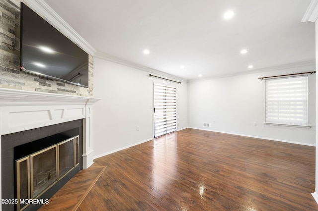 unfurnished living room featuring wood finished floors, visible vents, recessed lighting, a fireplace, and ornamental molding