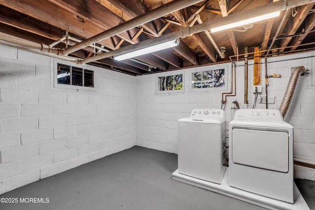 laundry area with laundry area and washer and clothes dryer