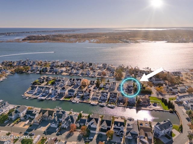 bird's eye view featuring a water view and a residential view