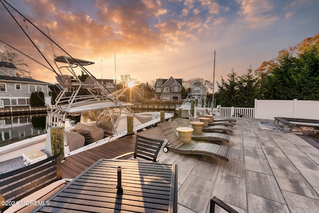 patio terrace at dusk with an outdoor hot tub