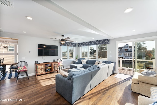 living area featuring recessed lighting, wood finished floors, visible vents, and baseboards