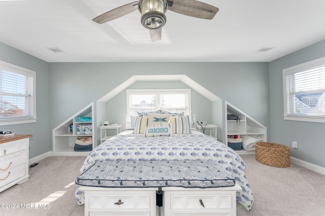 bedroom with visible vents, light carpet, and baseboards