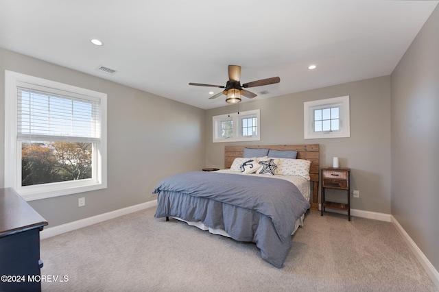 bedroom featuring recessed lighting, baseboards, visible vents, and light carpet