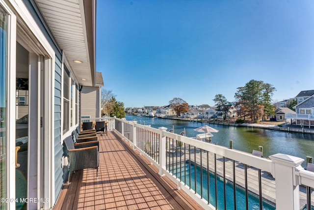 balcony featuring a water view