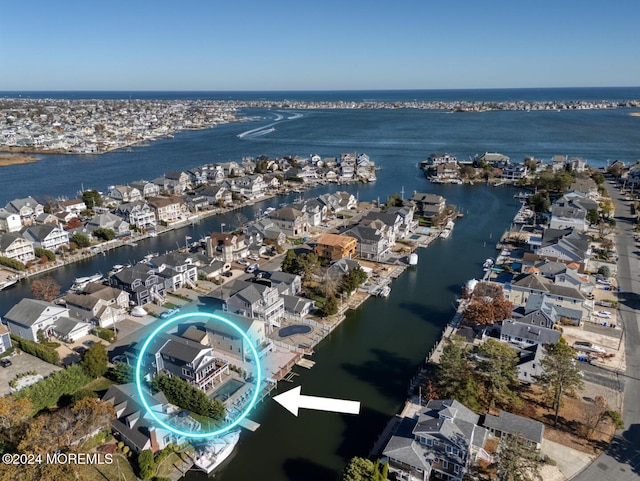 birds eye view of property featuring a residential view and a water view