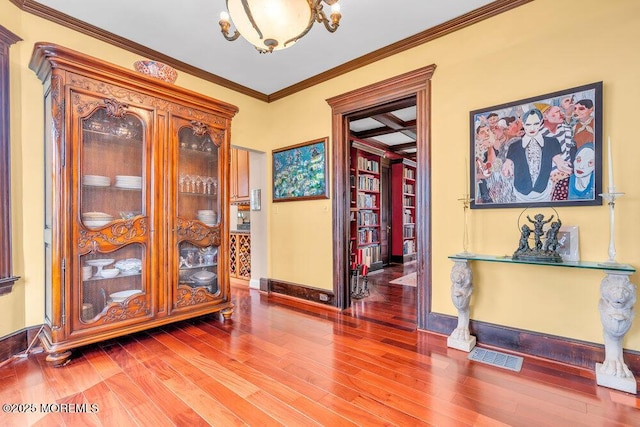 304 8th Ave, Asbury Park, NJ 07712 - entryway with wood finished floors, ornamental molding, and baseboards