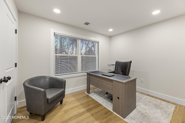 office area with light wood finished floors, recessed lighting, and baseboards